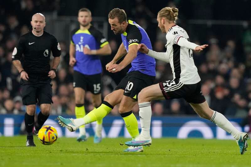 Tottenham's Harry Kane, centre, is challenged by Fulham's Tim Ream. AP Photo 