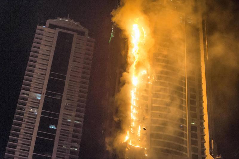 DUBAI. UNITED ARAB EMIRATES, 04 AUGUST 2017. A massive fire rips through The Marina Torch tower's southern corner. (Photo: Antonie Robertson) Journalist: None. Section: National.