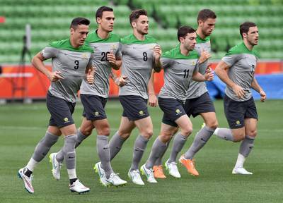 Australia players jog during their final training session ahead of the Asian Cup in Melbourne on January 8, 2015. William West / AFP