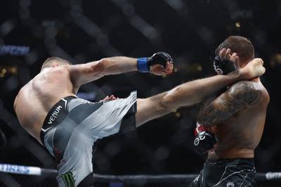 Justin Gaethje throws a kick to the head of Dustin Poirier that ended the fight in Round 2. Reuters