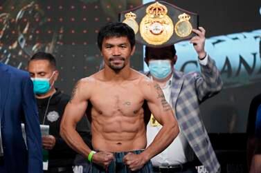 Manny Pacquiao, of the Philippines, poses for photographers during a weigh-in Friday, Aug.  20, 2021, in Las Vegas.  Pacquiao is scheduled to fight Yordenis Ugas, of Cuba, in a welterweight championship bout Saturday in Las Vegas.  (AP Photo / John Locher)