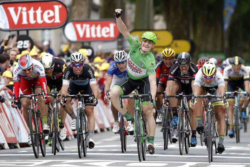 Germany's Andre Greipel, centre, celebrates as he crosses the finish line ahead of Norway's Alexander Kristoff, far left, Norway's Edvald Boasson Hagen, second left, Britain's sprinter Mark Cavendish, third left, Germany's John Degenkolb, third from right, and Peter Sagan, second right, to win the fifth stage of the Tour de France in Amiens, France, Wednesday, July 8, 2015. (AP Photo/Laurent Cipriani)