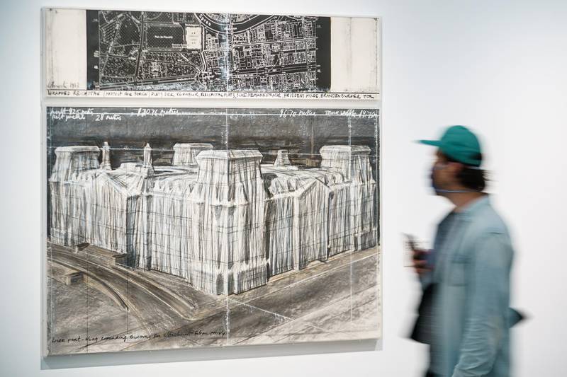 A visitor walk past the charcoal drawing 'Wrapped Reichstag (Project for Berlin)' (1983) at the exhibition 'Christo and Jeanne-Claude: Projects 1963-2020' at the PalaisPopulaire in Berlin, Germany, in May 2020. EPA