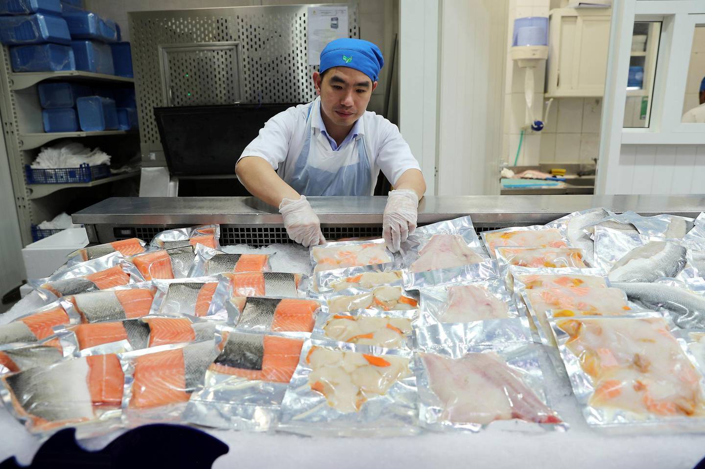 ABU DHABI , UNITED ARAB EMIRATES ,  November 22 , 2018 :- Ramos Caswang , worker at the Souq Planet arranging different varieties of Irish fish at the Souq Planet in Etihad Plaza in Abu Dhabi. ( Pawan Singh / The National )  For News. 