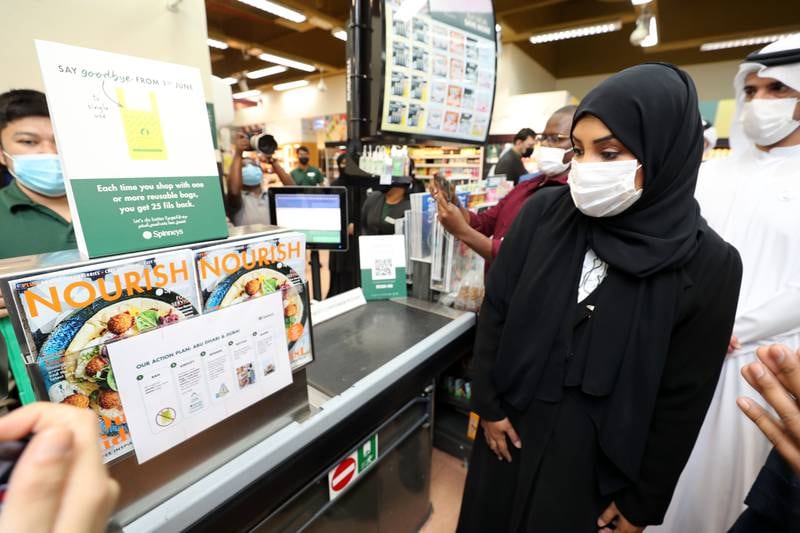 Signs at Spinneys on Abu Dhabi's Muroor Road inform the public that from June 1, 2022, shops cannot stock single-use plastic bags.