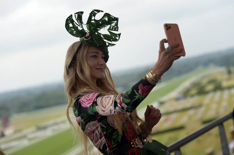 Racegoers take selfies during Royal Ascot 2021 at Ascot Racecourse in Ascot, England. Getty Images