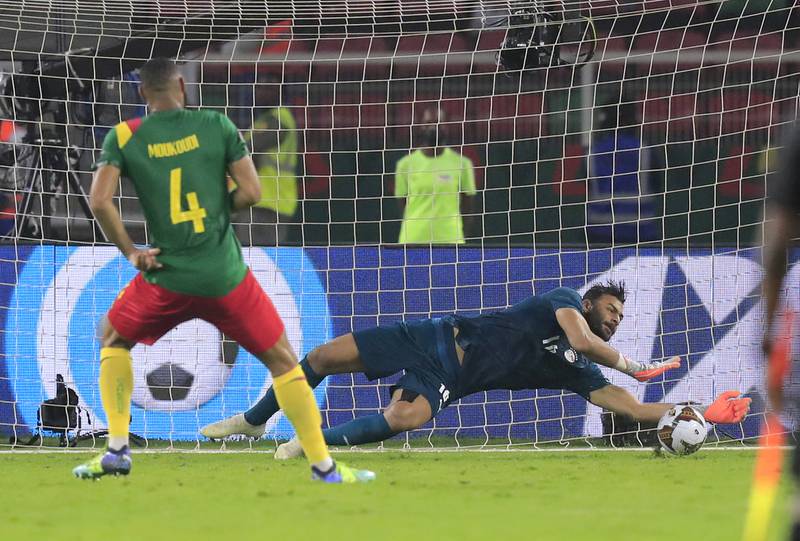 Egypt goalkeeper Mohamed Abou Gabal saves from Cameroon's Harold Moukoudi in the shootout. Reuters