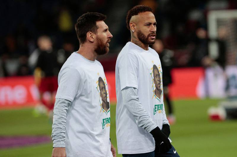 Lionel Messi and PSG's Brazilian forward Neymar wear a t-shirt with the portrait of late Brazilian legend Pele before the match. AFP
