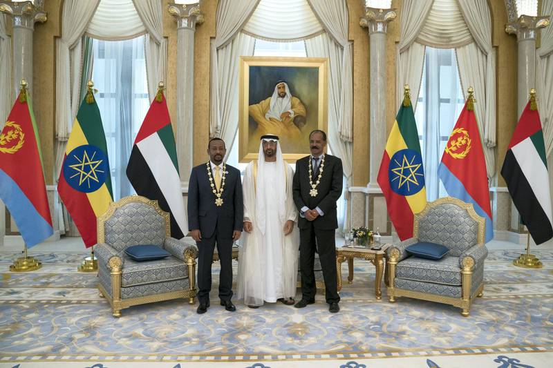 ABU DHABI, UNITED ARAB EMIRATES - July 24, 2018: HH Sheikh Mohamed bin Zayed Al Nahyan Crown Prince of Abu Dhabi Deputy Supreme Commander of the UAE Armed Forces (C), presents a Zayed Medal to HE Dr Abiy Ahmed, Prime Minister of Ethiopia (L) and HE Isaias Afwerki, President of Eritrea (R), during a reception at the Presidential Palace. 

( Hamad Al Kaabi / Crown Prince Court - Abu Dhabi )
---