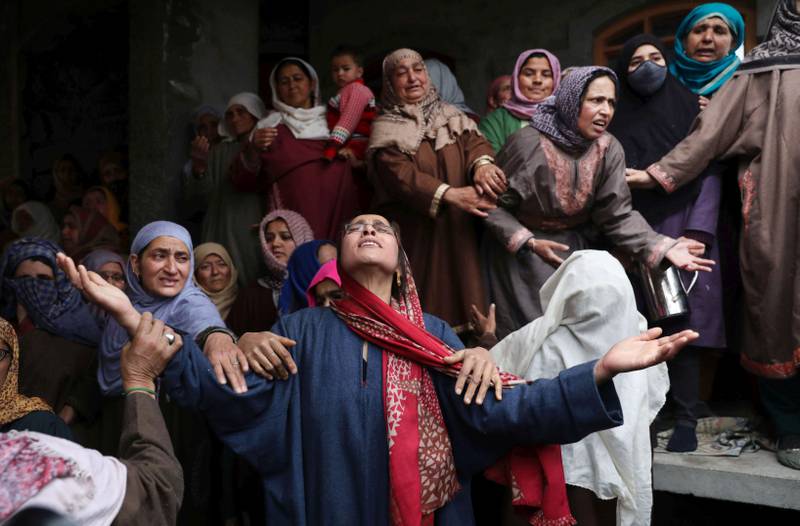 Relatives and friends at the funeral of Rafiya Nazir, 24, who was killed when a grenade exploded at a market in Srinagar in March. EPA