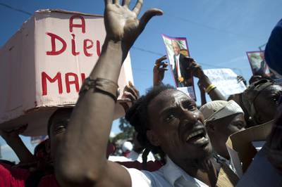Demonstrators march during a protest against the government of President Michel Martelly in Port-au-Prince. Hector Retamal / AFP