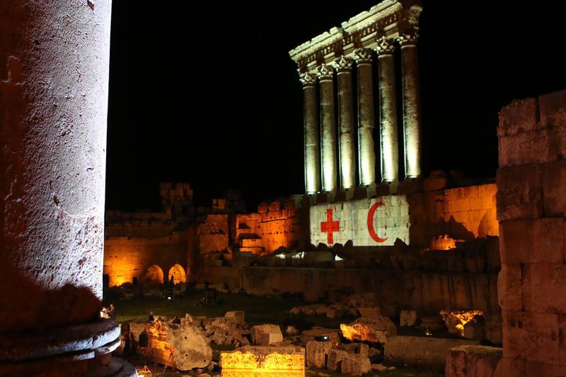The columns of the Roman Temple of Jupiter in the Lebanese city of Baalbeck in the eastern Bekaa valley are lit with the symbols of the Red Cross and Crescent. AFP