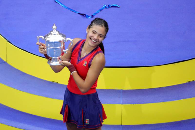 Britain's Emma Raducanu celebrates with the trophy after winning the 2021 US Open.  AFP