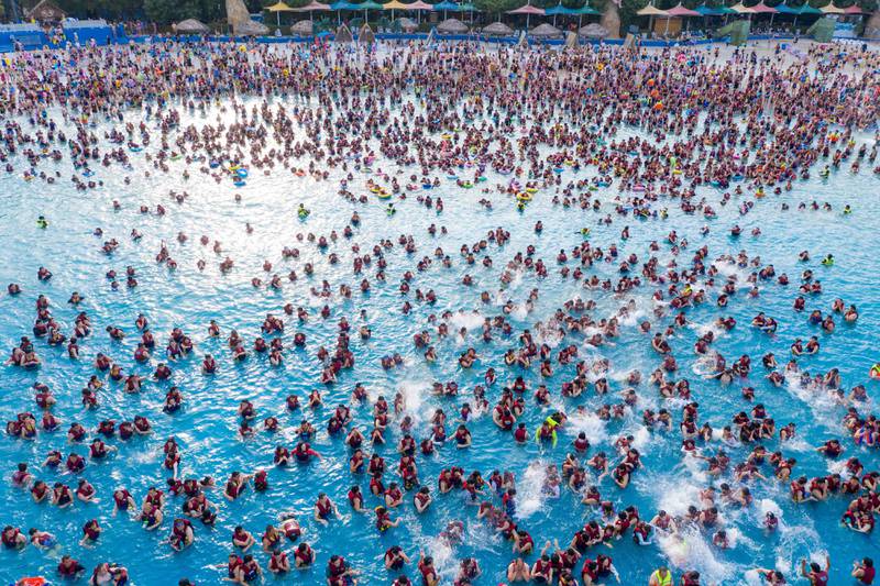 People enjoying a pool at a water park in Zhengzhou, in China's central Henan province.  AFP