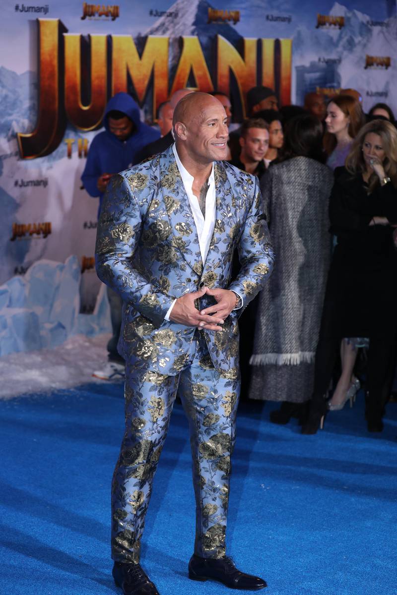 epa08058716 US actor Dwayne Johnson poses on the red carpet prior to the premiere of the movie 'Jumanji: The Next Level' at the TCL Chinese Theater in Los Angeles, California, USA, 09 December 2019. The movie will be released in US theaters on 13 December.  EPA-EFE/DAVID SWANSON