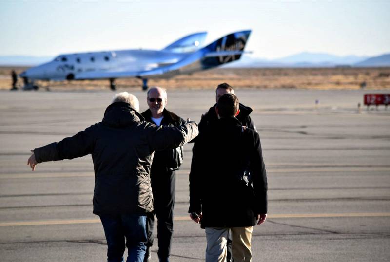 Sir Richard Branson and George Whitesides congratulate Chief Pilot Dave Mackay and Test Pilot Mark Stucky after a successful first glide flight of Virgin Spaceship Unity (VSS Unity) in Mojave Desert on 3rd December 2016.