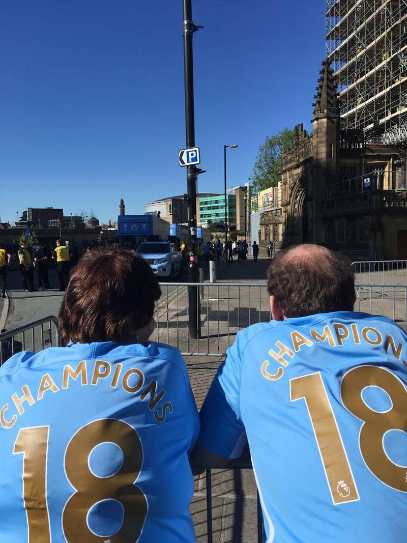 Man City fans get a great spot ahead of the club's open-top bus tour to celebrate their record-breaking Premier League campaign. Claire Corkery / The National