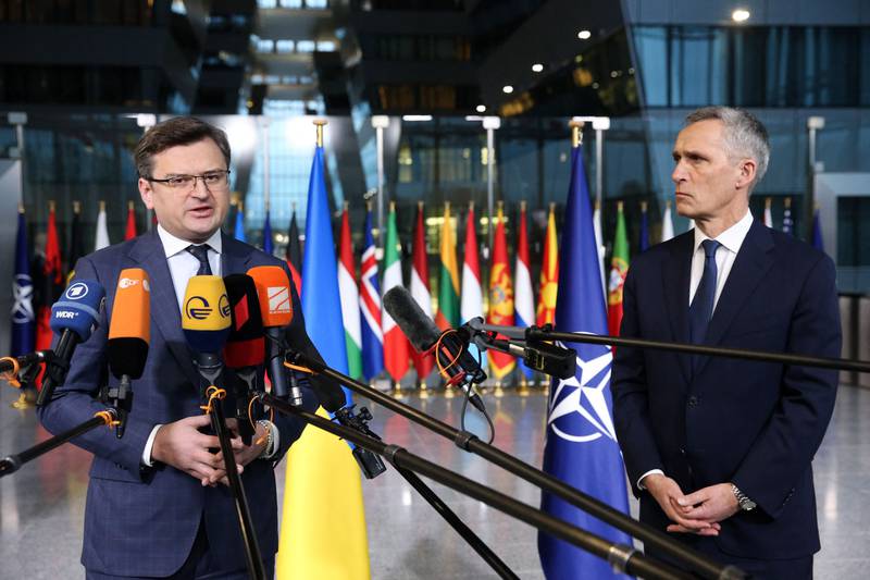 Ukraine's Foreign Minister Dmytro Kuleba, left, pleaded for more weapons from Nato Secretary General Jens Stoltenberg. AFP
