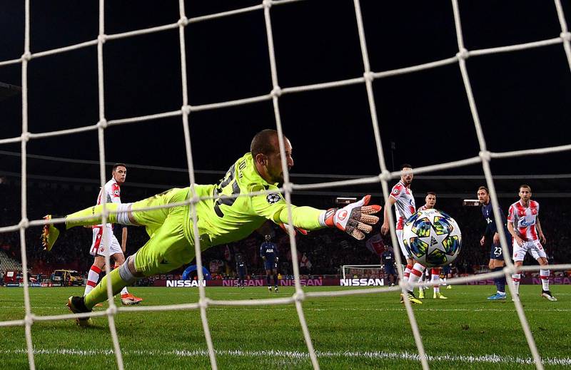 Red Star goalkeeper Milan Borjan cannot stop Christian Eriksen's shot making the score 4-0. Reuters