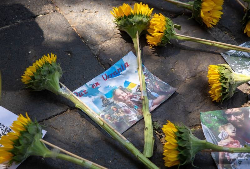 View of flowers and banners calling for 'peace in Ukraine' put up by Amnesty International activists in front of the Russian Embassy in Mexico City in March. EPA