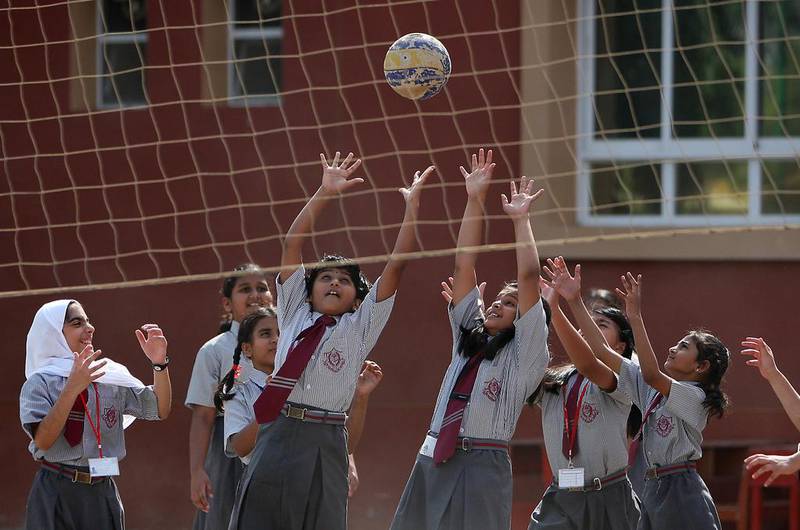 Students playing volley ball during the physical education class on the first day of school after summer vacations at The Elite English School in Dubai. Pawan Singh / The National 