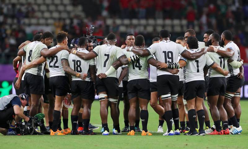 OITA, JAPAN - OCTOBER 09: The Fiji players huddle following the Rugby World Cup 2019 Group D game between Wales and Fiji at Oita Stadium on October 09, 2019 in Oita, Japan. (Photo by Koki Nagahama/Getty Images)
