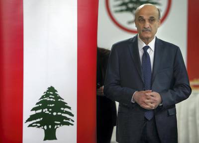Samir Geagea, leader of the Christian Lebanese Forces party, enters a hall to meet with his senior party officials to announce his candidacy for the Lebanese presidency, in Maarab east Beirut, Lebanon, Friday April 4, 2014. The former Lebanese warlord who now leads a Christian right-wing party has announced he will run for president in the tiny Arab country's elections later this spring. According to Lebanon's power-sharing system, the president must be a Maronite Christian, the prime minister a Sunni Muslim and the parliament speaker a Shiite Muslim. (AP Photo/Hussein Malla)