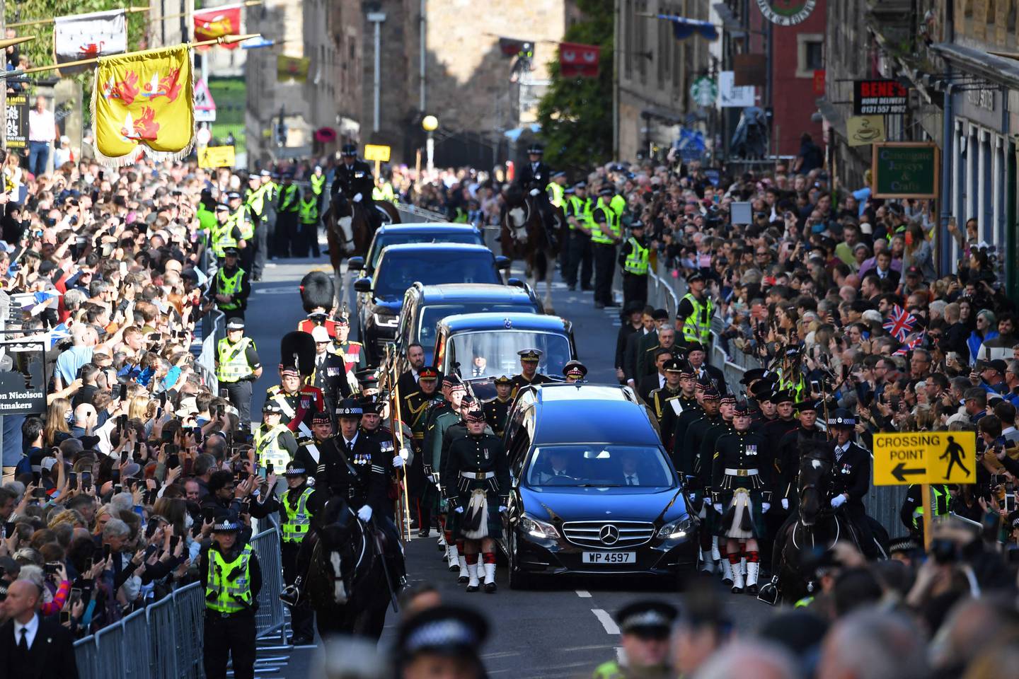 The procession of Queen Elizabeth II's coffin, from the Palace of Holyroodhouse to St Giles’ Cathedral, on the Royal Mile in Edinburgh on Monday. AFP