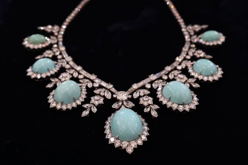 A necklace of white diamonds and pale turquoise.