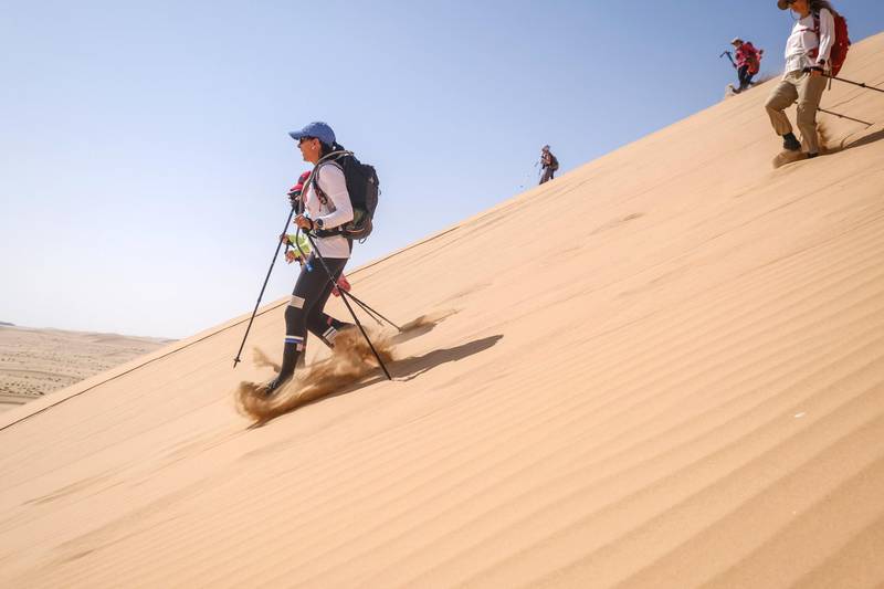 Walkers make a descent down a dune. Courtesy Women’s Heritage Walk