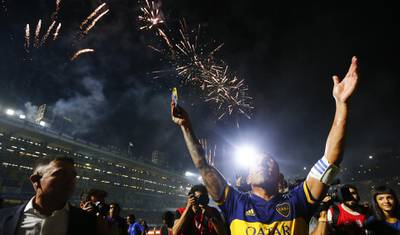 Carlos Tevez of Boca Juniors celebrates after winning the Argentinian Primera Division title at Alberto J. Armando Stadium in Buenos Aires on Saturday March 7. Getty