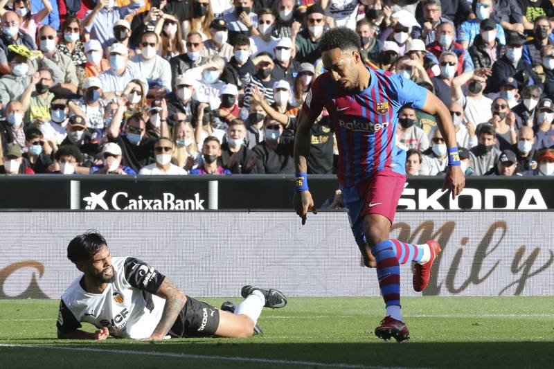 Barcelona's Pierre-Emerick Aubameyang, right, reacts as he scores the opening goal. AP Photo