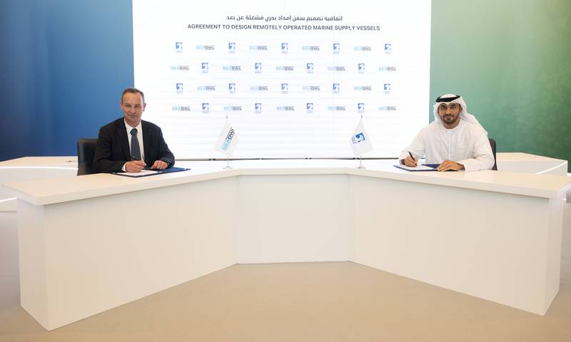 Abdulkareem Al Masabi, chief executive of Adnoc Logistics & Services, right, and Xavier Genin, chief executive of SeaOwl, during the signing ceremony for the development of the vessels. Photo: Adnoc L&S
