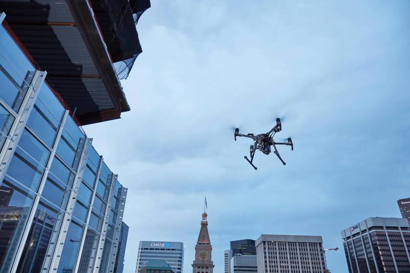 This February 2017 photo provided by DJI Technology Inc. shows a test of a type of drone in downtown Denver, that the New York Police Department can use to reduce risk to officers and bystanders during a response to dangerous situations. The department said Tuesday, Dec. 4, 2018, that potential uses for its 14 drones include search and rescue, hard-to-reach crime scenes, hostage situations, and hazardous material incidents. (DJI Technology Inc. via AP)