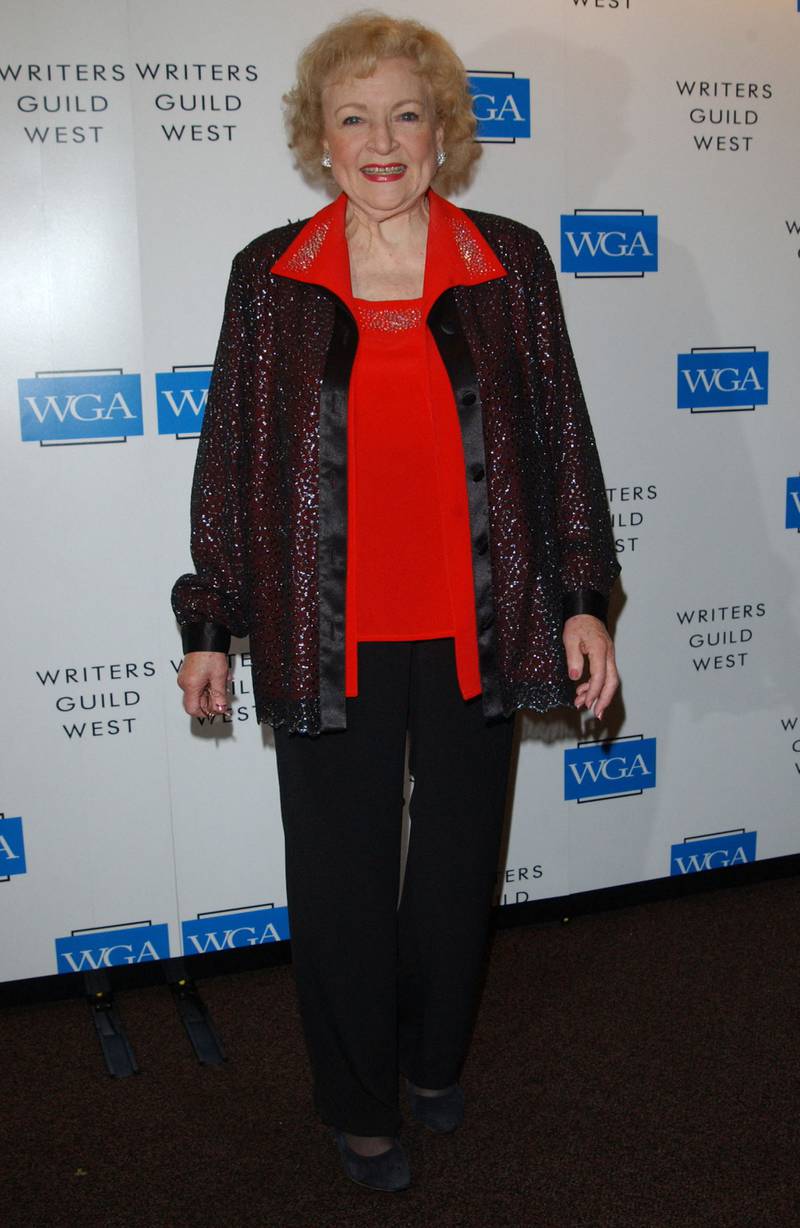 Betty White, in a red shirt and sequinned jacket, poses during the Writers Guild Awards held at the Palladium in Hollywood on February 25, 2005. AFP