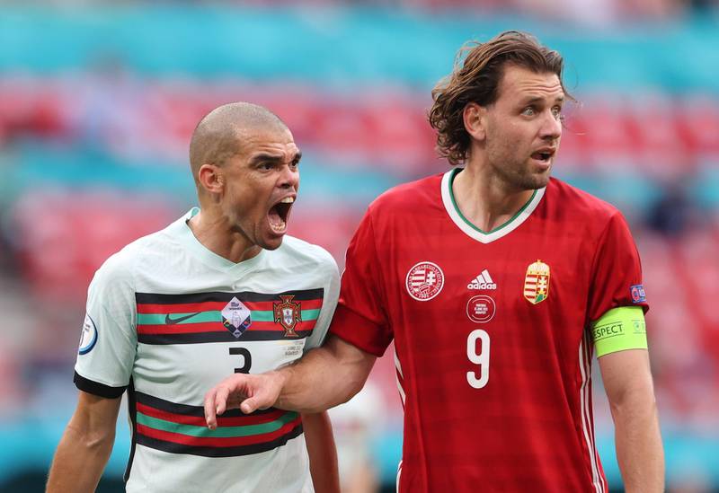 Portugal's Pepe shouts in the ear of Adam Szalai of Hungary. Reuters