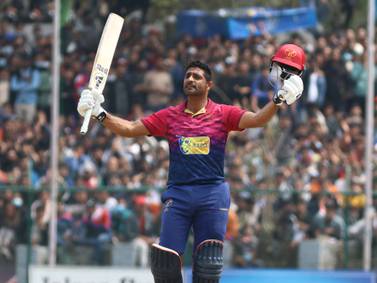 Asif Khan of UAE celebrates his century in the ICC Cricket World Cup League 2 match between United Arab Emirates (UAE) and Nepal at the TU International Cricket Stadium, Kathmandu, Nepal on Thursday, 16th March 2023. Subas Humagain for The National