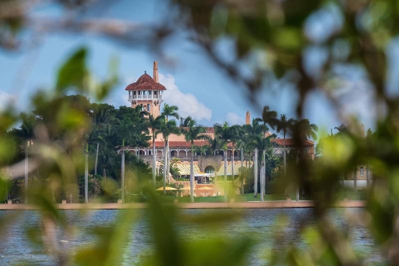 FILE - This Nov. 23, 2018 file photo shows President Donald Trump's Mar-a-Lago estate behind mangrove trees in Palm Beach, Fla. On Saturday, March 30, 2019, a woman carrying two Chinese passports and a device containing computer malware lied to Secret Service agents and briefly gained admission to the club over the weekend during his Florida visit, federal prosecutors allege in court documents. (AP Photo/J. David Ake)