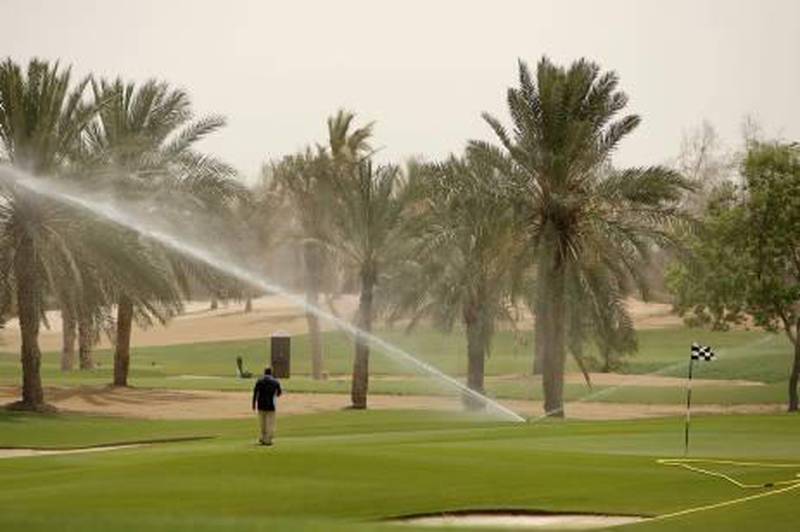 ABU DHABI, UNITED ARAB EMIRATES - June 10, 2009: Sprinklers and water help keep the grass green at Abu Dhabi Golf Club. ( Ryan Carter / The National )*** stock, water, golf, green, sprinklers *** Local Caption ***  RC029-UAEgolf.JPG RC029-UAEgolf_2.JPGRC029-UAEgolf_2.JPG