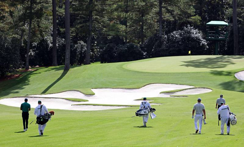 Tiger Woods, Justin Thomas, Bryson DeChambeau and Fred Couples walk during a practice round prior to the Masters. AFP