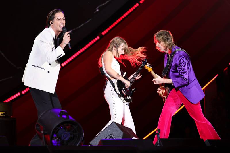 From left, Damiano David, Victoria De Angelis and Thomas Raggi of the Italian rock band Maneskin perform during Global Citizen Festival. AFP