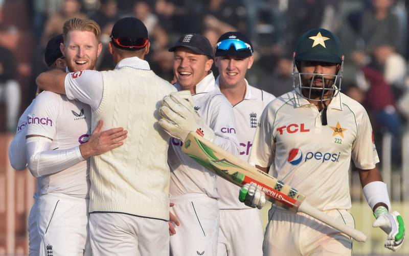 England's players celebrate the dismissal of Pakistan's captain Babar Azam on day four of the Rawalpindi Test on Sunday, December 4, 2022. Reuters