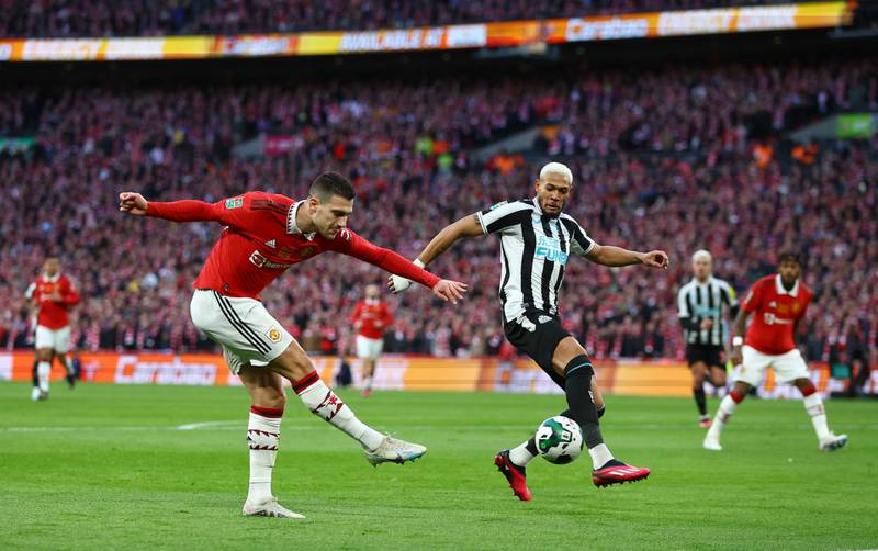 Manchester United's Diogo Dalot in action with Newcastle United's Joelinton. Reuters