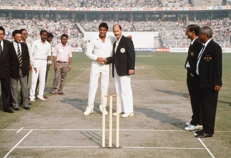 CALCUTTA, INDIA - NOVEMBER 10:  South African captain Clive Rice (r) shakes hands with India captain Mohammad Azharuddin at the coin toss before the 1st ODI between India and South Africa at Eden Gardens in Calcutta, India on November 10, 1991, this was South Africa's first tour after readmission to the ICC. (Photo Shaun Botterill/Allsport/Getty Images)