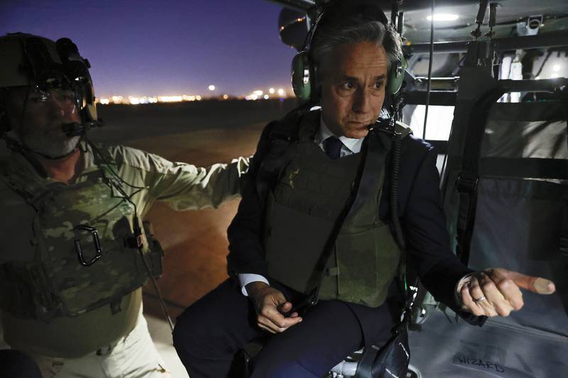 Mr Blinken on a helicopter in Baghdad on Sunday. AP