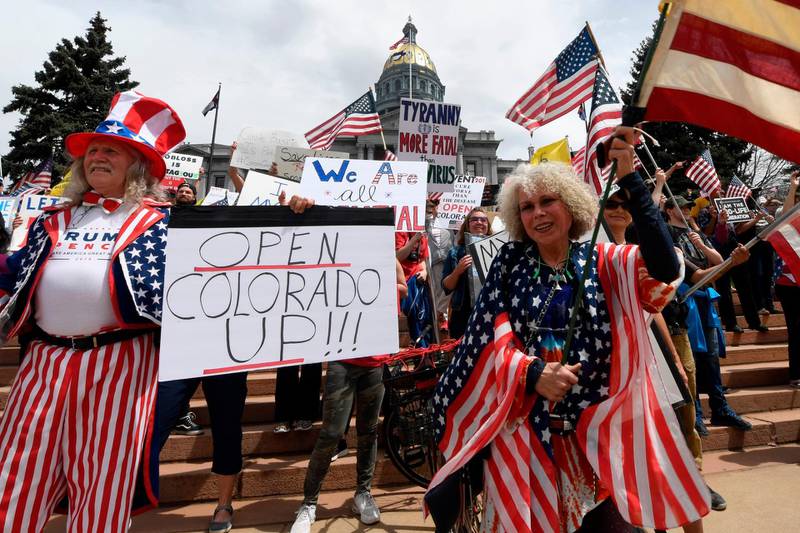 Protestors demonstrate against new safer-at-home orders during the “End the Lockdown Now” rally at the Colorado Capital in Denver, Colorado. Stay-at-home orders have been in place throughout the US to protect against the spread of the novel coronavirus, and has led to a week of demonstrations across the country.   AFP