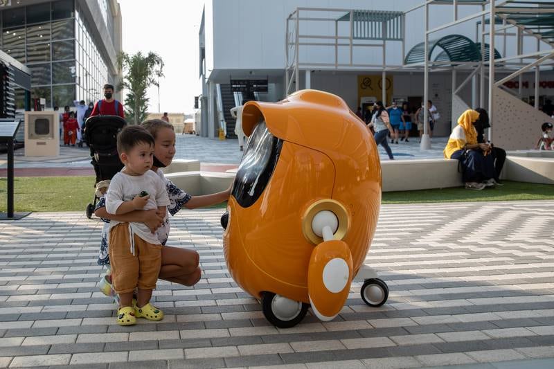 The Opti robots are specially designed to be at a child's level. Photo: Christophe Viseux / Expo 2020 Dubai