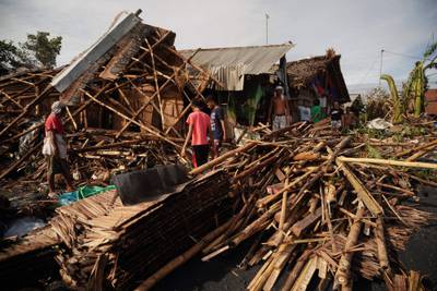 Residents salvage belongings from their destroyed homes in the coastal town of Dulag in Leyte province. AFP