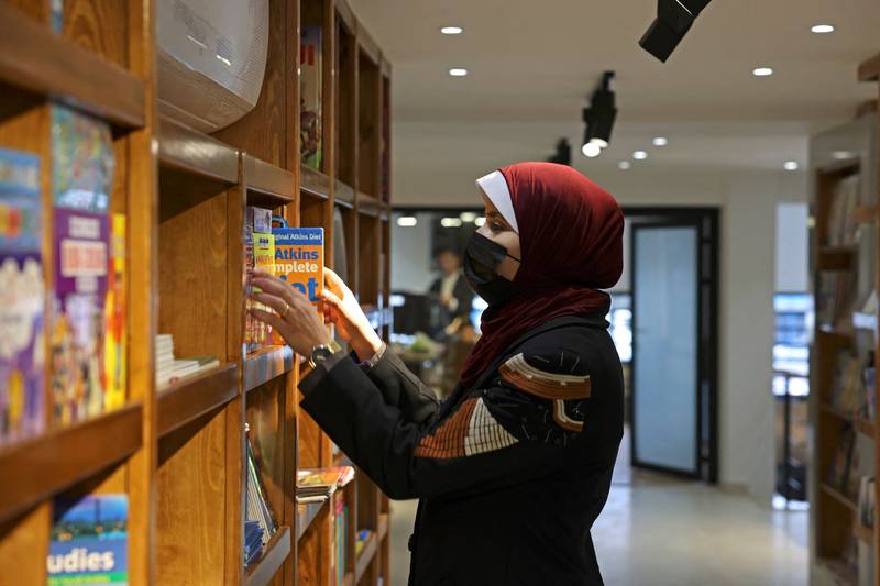 A Palestinian attends the reopening of the new Samir Mansour bookshop after it was destroyed during last year's 11-day war between Israel and the Palestinian Hamas movement, in Gaza City. Mansour's beloved bookshop has been rebuilt and restocked following an international fundraiser. All photos: AFP