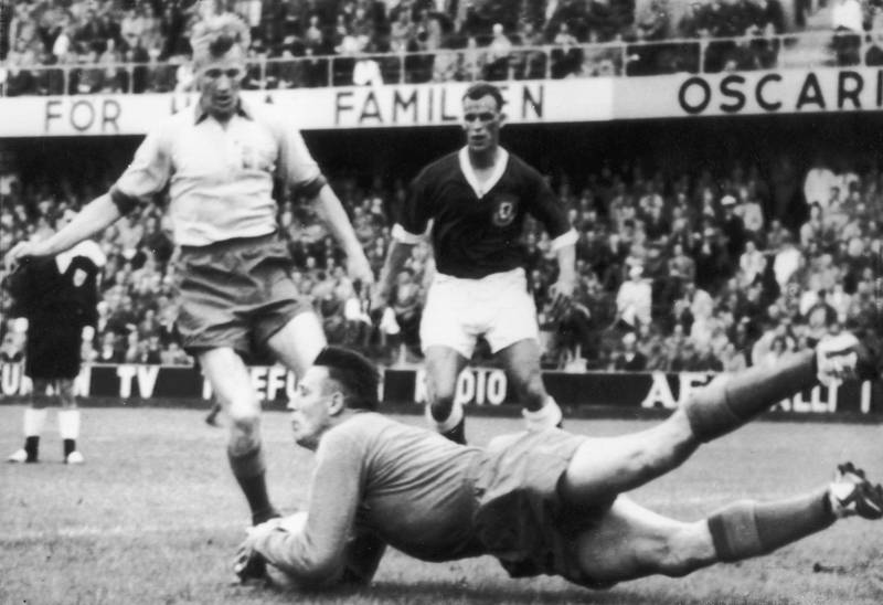Swedish goalkeeper Kalle Svensson, assisted by full back Sven Axbom, saves a shot from John Charles during a group stage match between Sweden and Wales at the 1958 World Cup. Wales progressed from the group stage to face Brazil in the quarter finals. 